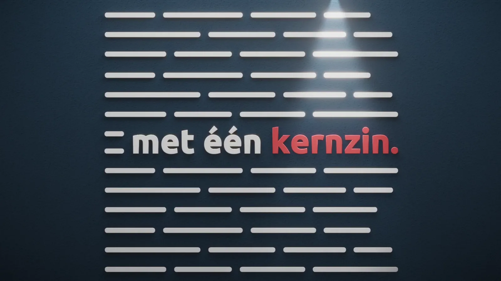 Tekstregels op een donkere wand, met in het midden de woorden: met één kernzin.
